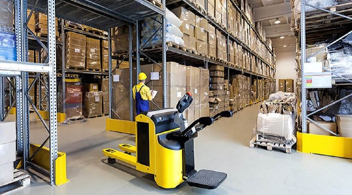 Warehouse employees managing inventory on high shelving units